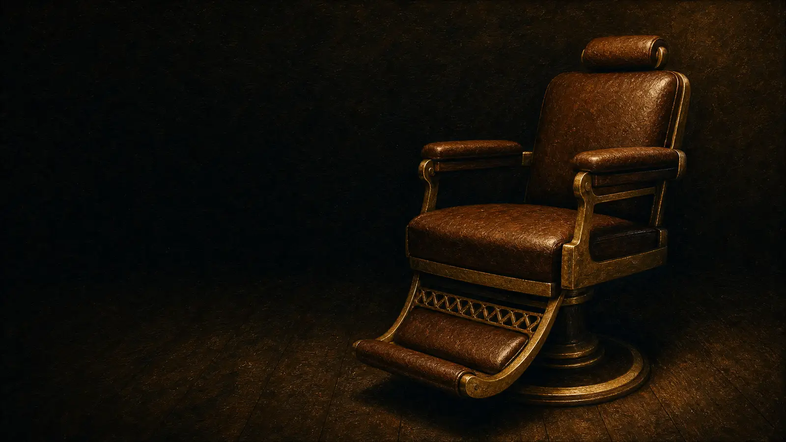 A gold and brown leather barber chair alone under one warm light